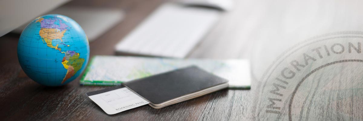 Passport and a globe on a desk