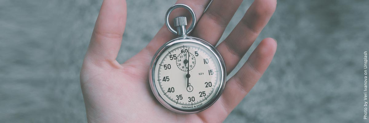 A stopwatch held in the palm of a hand