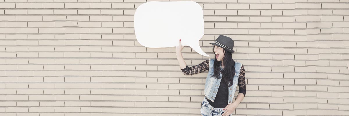 Young Woman holding a paper speech bubble