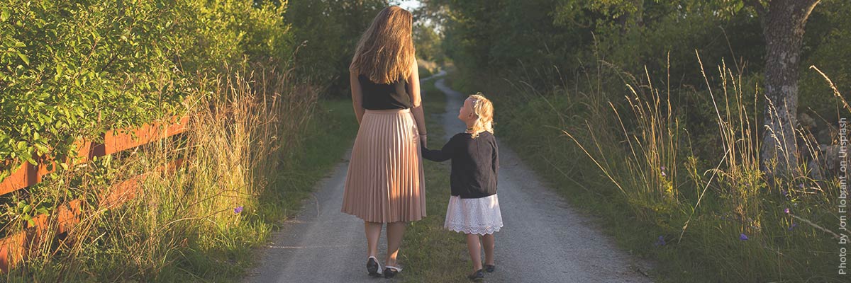 Au pair walking with guest child