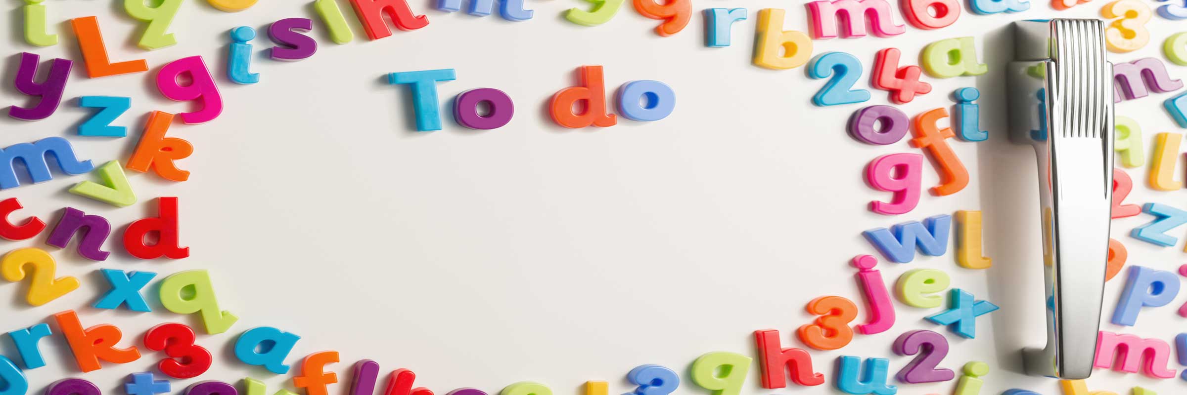 A refrigerator door with magnetic letters that spell "To Do".
