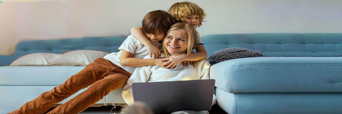 Mom working at home with her kids.