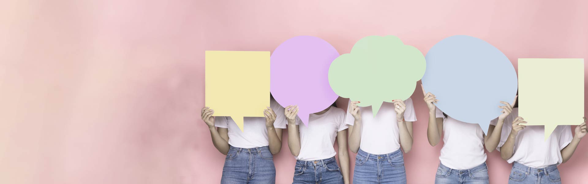 Young women holding speechbubbles