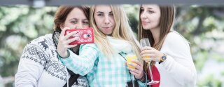 Some other au pairs take a selfie at the balcony