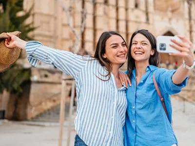 two young woman doing a selfie