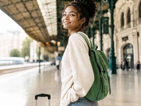 Woman waiting at a train station
