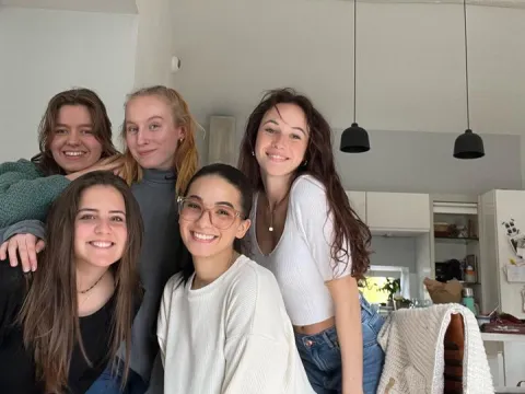 Girls hanging out at someones apartment