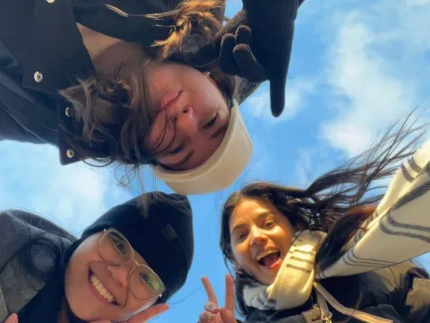 Girls posing with peace sign