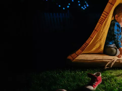 Au pair with child in an tent
