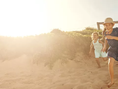 A family being excited about going to the beach