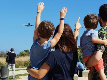 A family with two children looking to the horizon