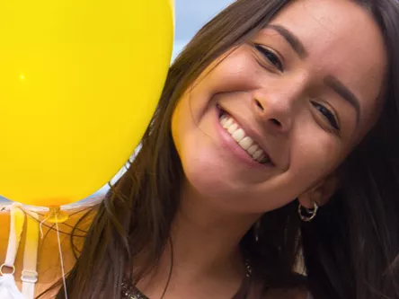 A young woman with a balloon