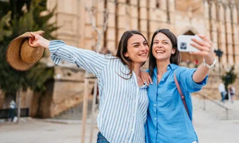 two young woman doing a selfie