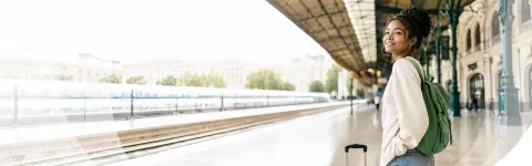 Woman waiting at a train station