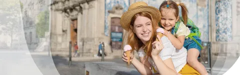 A Woman eating some icecreme with a child