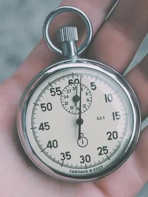 A stopwatch held in the palm of a hand