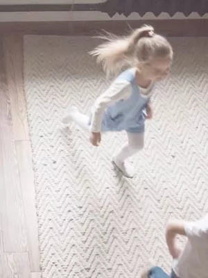Parents searching online for an Au-pair. Kids are playing.