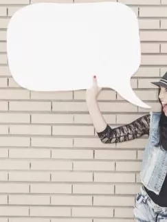 Young Woman holding a paper speech bubble