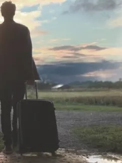 Someone who walks with a suitcase