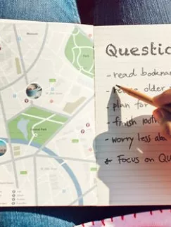 Writing notes in a notebook