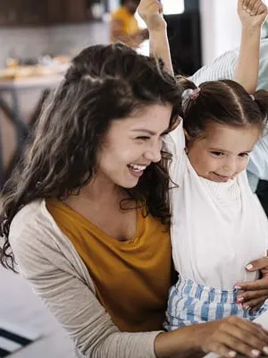 A family in front of a laptop